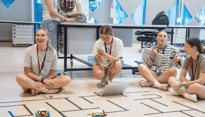 High school students experimenting with robotics