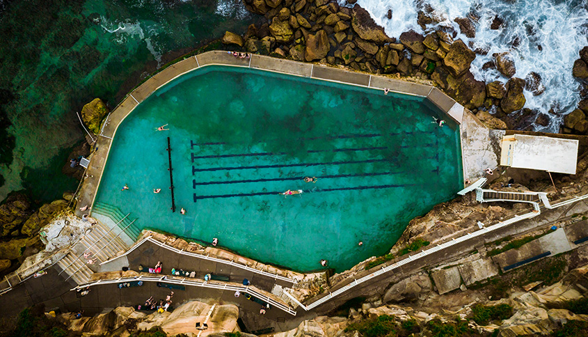 Swimmers in an ocean pool. 
