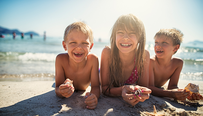 Kids holding sea shells