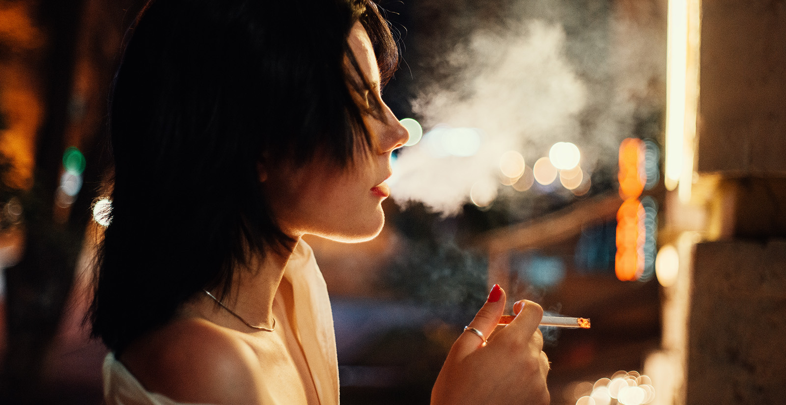 A woman smoking a cigarette.