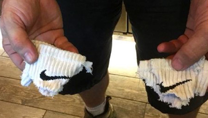 Man cut Nike socks in protest