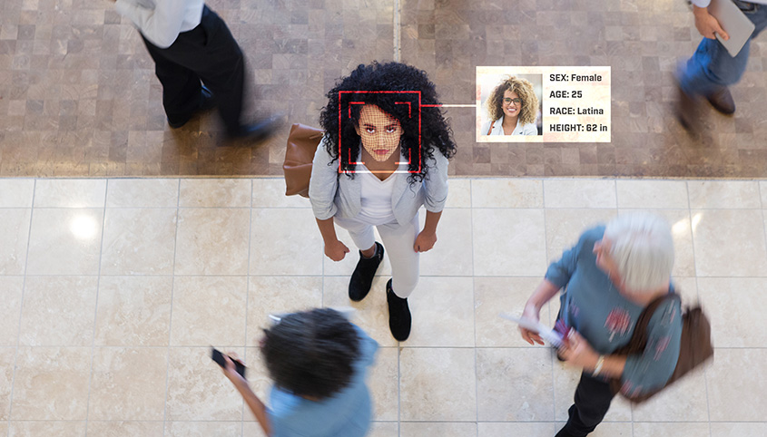 A woman is recognised by facial recognition software.