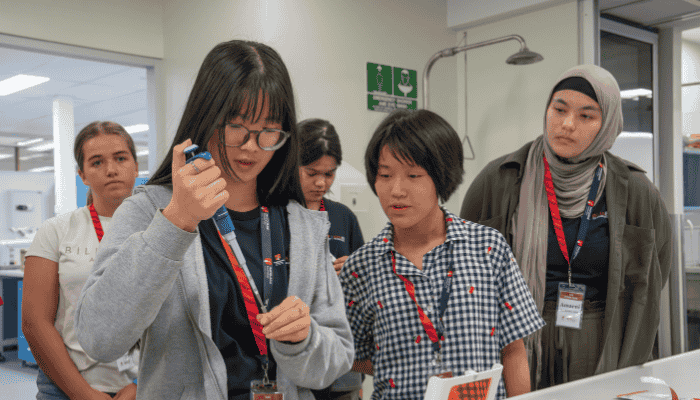 High school students in the lab with a syringe