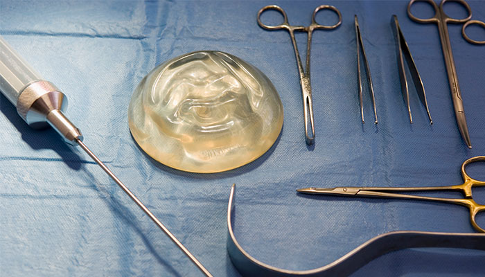 Breast implants laid out on a surgical table