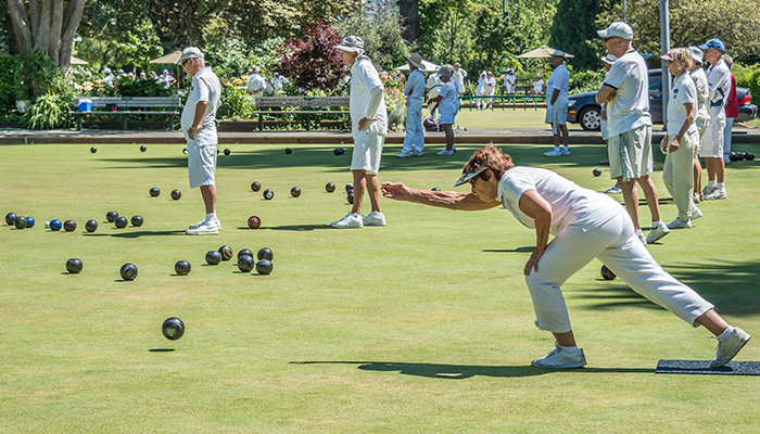 Woman playing lawn bowls