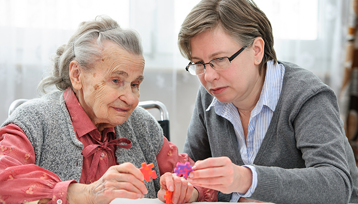 Senior woman with her elder care nurse