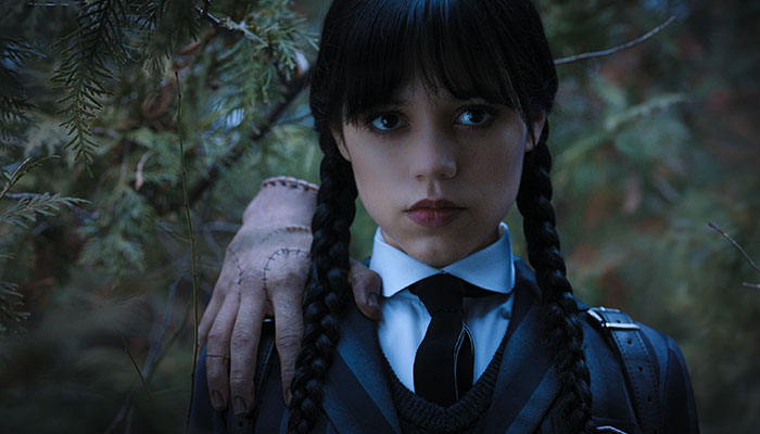 Wednesday Addams with 'Thing' on her shoulder