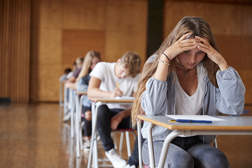 Students taking an exam. 