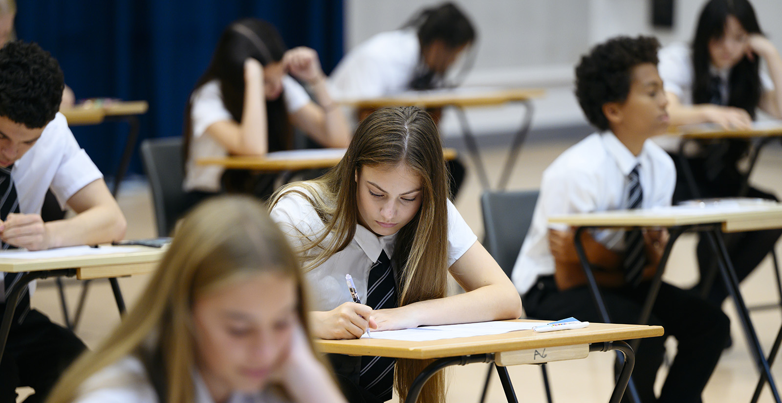 Students taking an exam. 
