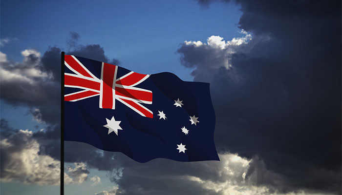 Australian flag against cloudy sky