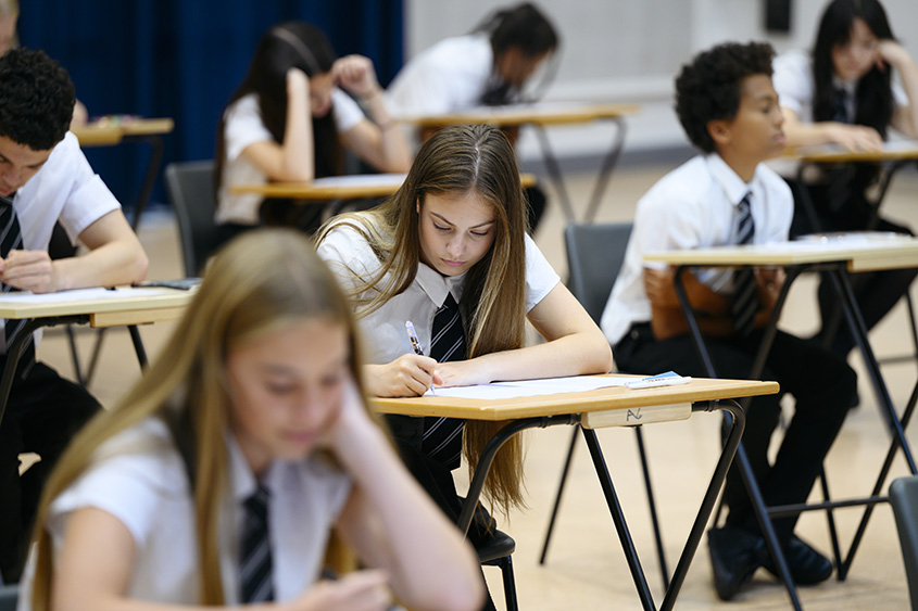 Students taking an exam. 
