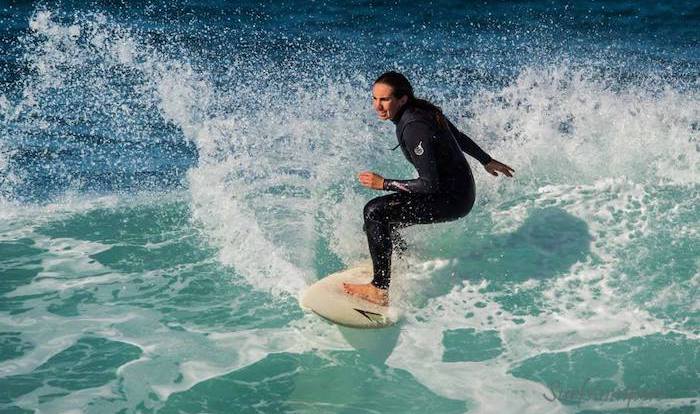 Dr Laura Ryan surfing in South Africa