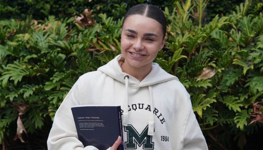 Amy Chessari holding book